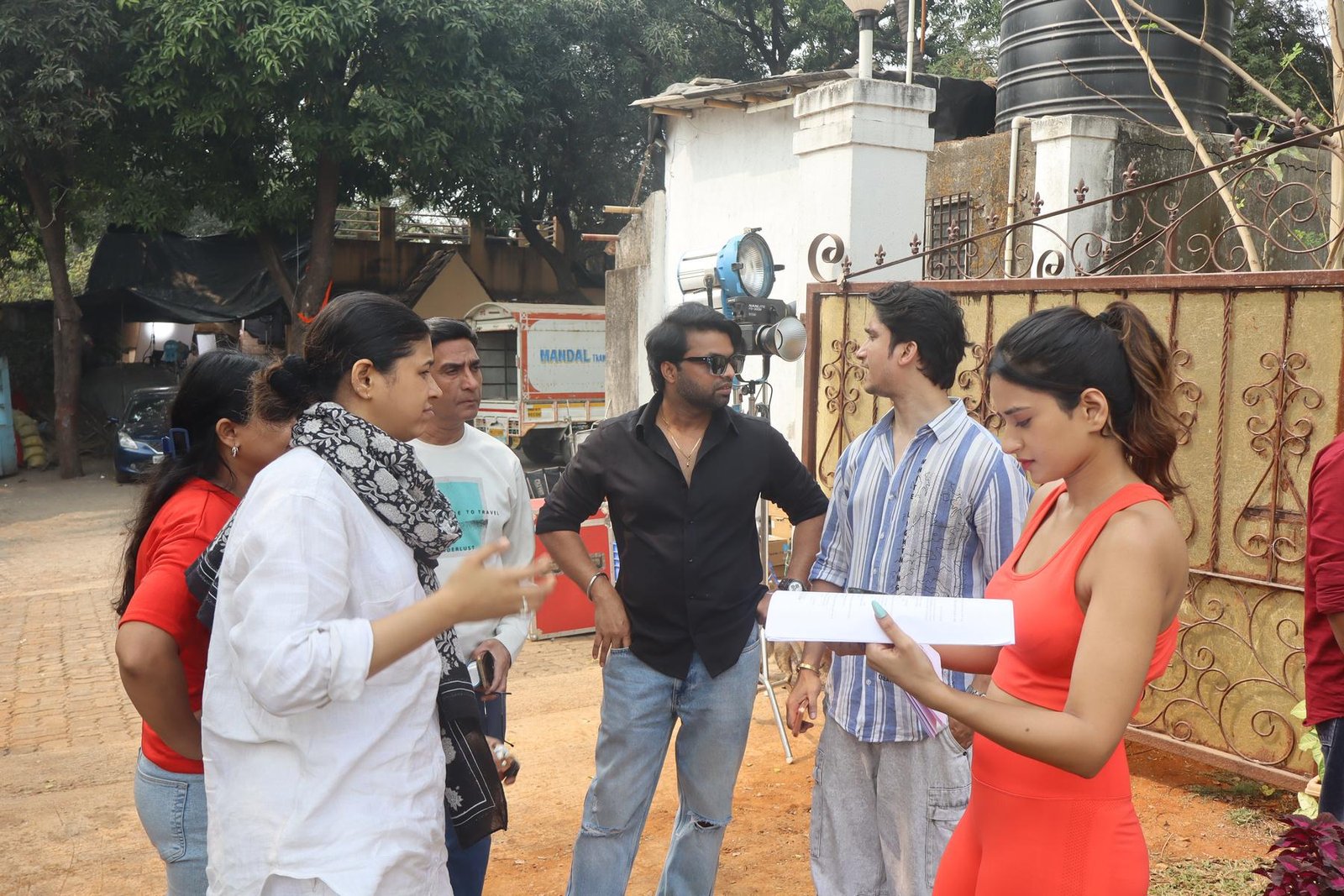Crew discussion on a location shoot